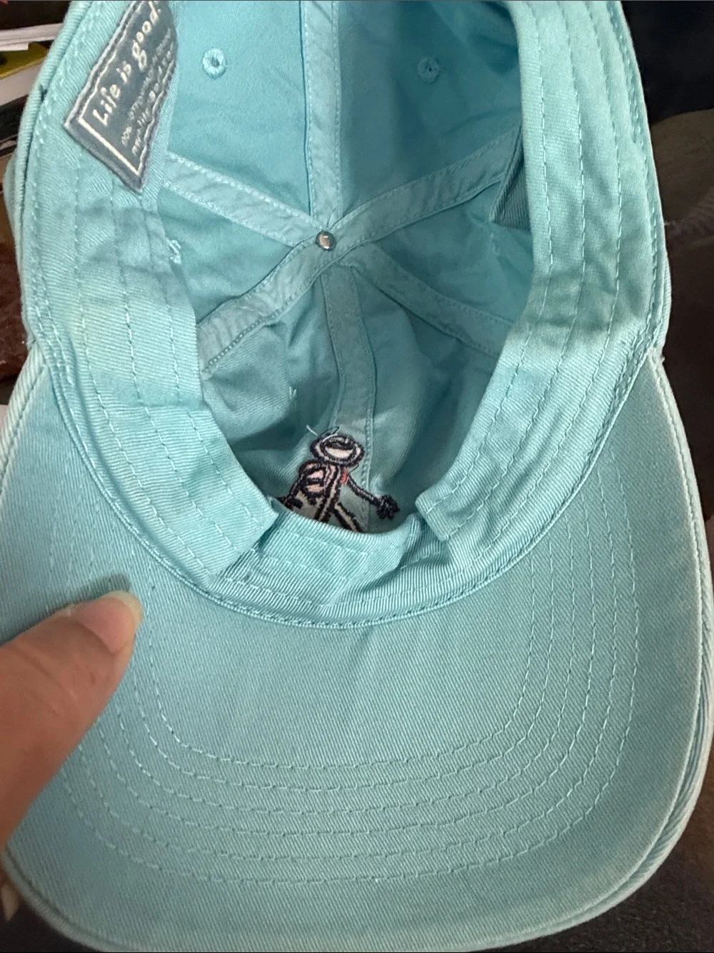 Life Is Good light blue dad hat with rollerblading stick-figure